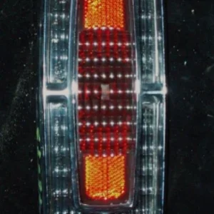 1965 Cadillac tail light chrome and glass (crack in the glass) Handla nu